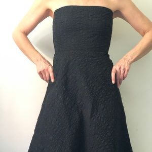 Strapless black J. Crew dress.
